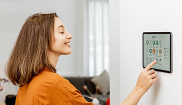 Smart home control panel being operated by a person